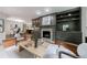 Inviting living room featuring a fireplace, custom built-ins, and hardwood floors at 2298 Pembrook Pl, Atlanta, GA 30324