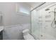 Elegant marble tiled shower with a glass door, providing an updated and luxurious feel to the bathroom at 2298 Pembrook Pl, Atlanta, GA 30324