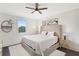 Bright bedroom featuring a tufted headboard, stylish decor, and a ceiling fan for added comfort at 2499 Peachtree Ne Rd # 503, Atlanta, GA 30305