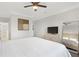 Spacious bedroom with neutral colors, a large bed, and a full-length mirror at 2499 Peachtree Ne Rd # 503, Atlanta, GA 30305