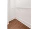 Walk-in closet featuring wood-look floors and ample space for storage and organization at 2499 Peachtree Ne Rd # 503, Atlanta, GA 30305