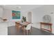 Charming dining area with modern table and chairs, colorful art, with convenient access to the kitchen and a clean aesthetic at 2499 Peachtree Ne Rd # 503, Atlanta, GA 30305