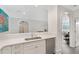 Open-concept kitchen with marble countertops, white cabinets, and stainless steel appliances at 2499 Peachtree Ne Rd # 503, Atlanta, GA 30305