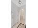 Convenient laundry room adjacent to entryway, featuring a modern washer and dryer with ample shelving for storage at 2499 Peachtree Ne Rd # 503, Atlanta, GA 30305