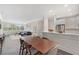Bright living space with open floor plan, featuring a modern kitchen, dining area, and comfortable seating with city views at 2499 Peachtree Ne Rd # 503, Atlanta, GA 30305