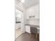 Compact home office with built-in storage and a view to a well-appointed bathroom at 2499 Peachtree Ne Rd # 503, Atlanta, GA 30305