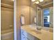 Well-lit bathroom features a bathtub with a white single sink vanity at 475 Vinings Estates Se Dr # A03, Smyrna, GA 30126