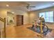 Spacious bonus room with hardwood floors, a ceiling fan, and natural light at 475 Vinings Estates Se Dr # A03, Smyrna, GA 30126