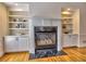 Elegant fireplace with a marble hearth, flanked by custom built-in bookshelves at 475 Vinings Estates Se Dr # A03, Smyrna, GA 30126