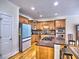 Modern kitchen boasting custom cabinetry, granite counters, and stainless steel appliances at 475 Vinings Estates Se Dr # A03, Smyrna, GA 30126