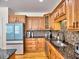 Stylish kitchen featuring granite countertops, updated appliances, and ample cabinet space at 475 Vinings Estates Se Dr # A03, Smyrna, GA 30126