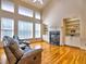 Inviting living room featuring a fireplace, built-in shelving, and large windows at 475 Vinings Estates Se Dr # A03, Smyrna, GA 30126