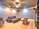 Living room with hardwood floors, recessed lighting, ceiling fan, and cozy furniture at 475 Vinings Estates Se Dr # A03, Smyrna, GA 30126