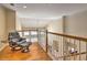 Cozy loft area with hardwood floors, leather recliner, and a serene view at 475 Vinings Estates Se Dr # A03, Smyrna, GA 30126