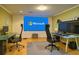 Bright office with two desks, ergonomic chairs, and a large display screen at 475 Vinings Estates Se Dr # A03, Smyrna, GA 30126