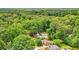 Aerial view of the property in a lush, green, wooded setting at 845 Stratford Rd, Avondale Estates, GA 30002