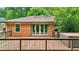 Beautiful deck with a hot tub and french doors leading into the brick house at 845 Stratford Rd, Avondale Estates, GA 30002