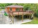 Expansive backyard deck featuring hot tub, with a covered patio area below at 845 Stratford Rd, Avondale Estates, GA 30002
