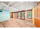 View of finished basement featuring new floors, access to the backyard, and multiple windows at 845 Stratford Rd, Avondale Estates, GA 30002