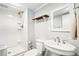 Bathroom with shower, toilet, sink, and mirror; freshly painted in gray and white at 845 Stratford Rd, Avondale Estates, GA 30002