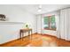 Bright bedroom with hardwood floors, large window, and a ceiling fan for comfortable living at 845 Stratford Rd, Avondale Estates, GA 30002