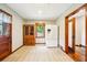 The dining area features hardwood floors, classic wooden furniture, and natural light from the window at 845 Stratford Rd, Avondale Estates, GA 30002