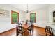 Well-lit dining room with hardwood floors, natural light, and traditional chandelier for a cozy atmosphere at 845 Stratford Rd, Avondale Estates, GA 30002