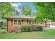 Charming brick home with a neatly landscaped front yard at 845 Stratford Rd, Avondale Estates, GA 30002