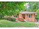 Charming brick home with well-manicured lawn and mature trees at 845 Stratford Rd, Avondale Estates, GA 30002