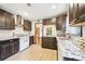 Bright kitchen offers granite counters, stainless hood, and subway tile backsplash, perfect for cooking enthusiasts at 845 Stratford Rd, Avondale Estates, GA 30002