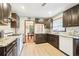 Featuring granite countertops, a white subway tile backsplash, and modern appliances, this kitchen is move-in ready at 845 Stratford Rd, Avondale Estates, GA 30002