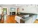 Inviting living room features hardwood floors, fireplace, and a comfortable, oversized gray sectional sofa at 845 Stratford Rd, Avondale Estates, GA 30002