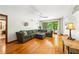 Open living area with hardwood floors, neutral decor, and deck access at 845 Stratford Rd, Avondale Estates, GA 30002