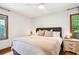 Comfortable main bedroom featuring a queen size bed, ceiling fan, and natural lighting at 845 Stratford Rd, Avondale Estates, GA 30002