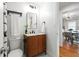 Bathroom featuring a modern vanity, toilet and view into the adjacent room at 1063 Manigault Se St, Atlanta, GA 30316