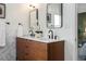Bathroom featuring a modern vanity with double sinks and black hardware fixtures at 1063 Manigault Se St, Atlanta, GA 30316