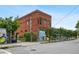 Exterior view of a red brick building with painted mural and street view at 1063 Manigault Se St, Atlanta, GA 30316