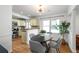 Bright dining area with decorative light fixture, adjacent to kitchen, hardwood floors and natural light at 1063 Manigault Se St, Atlanta, GA 30316