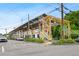 Commercial building with exposed beams, street parking, and landscaping at 1063 Manigault Se St, Atlanta, GA 30316