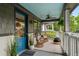 Charming front porch featuring comfortable seating, a ceiling fan, and stylish accents, great for outdoor enjoyment at 1063 Manigault Se St, Atlanta, GA 30316