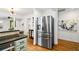 Modern kitchen featuring a stainless steel refrigerator and granite countertops at 1063 Manigault Se St, Atlanta, GA 30316