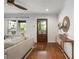 Elegant living room showcasing hardwood floors, neutral walls, and a decorative mirror, creating a warm ambiance at 1063 Manigault Se St, Atlanta, GA 30316