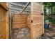 Private outdoor shower with stone floor, wooden walls, and a translucent roof for natural light at 1063 Manigault Se St, Atlanta, GA 30316