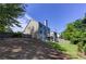 Expansive backyard featuring lush green grass and mature trees providing shade at 1892 Raven Hill Ne Dr, Atlanta, GA 30319
