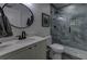 Modern bathroom with a walk-in shower, stylish vanity, and sleek fixtures at 1892 Raven Hill Ne Dr, Atlanta, GA 30319