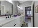 Bright bathroom featuring a double vanity with white countertops and modern fixtures at 1892 Raven Hill Ne Dr, Atlanta, GA 30319