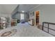 Spacious bedroom with plush carpet, playroom area, and well-organized closet at 1892 Raven Hill Ne Dr, Atlanta, GA 30319