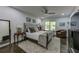 Comfortable bedroom with a metal-framed bed, neutral color palette, and modern ceiling fan at 1892 Raven Hill Ne Dr, Atlanta, GA 30319