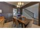 Elegant dining room features hardwood floors, stylish lighting, and wainscoting at 1892 Raven Hill Ne Dr, Atlanta, GA 30319