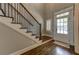 Stylish entryway with hardwood floors, staircase, and bright, welcoming light at 1892 Raven Hill Ne Dr, Atlanta, GA 30319